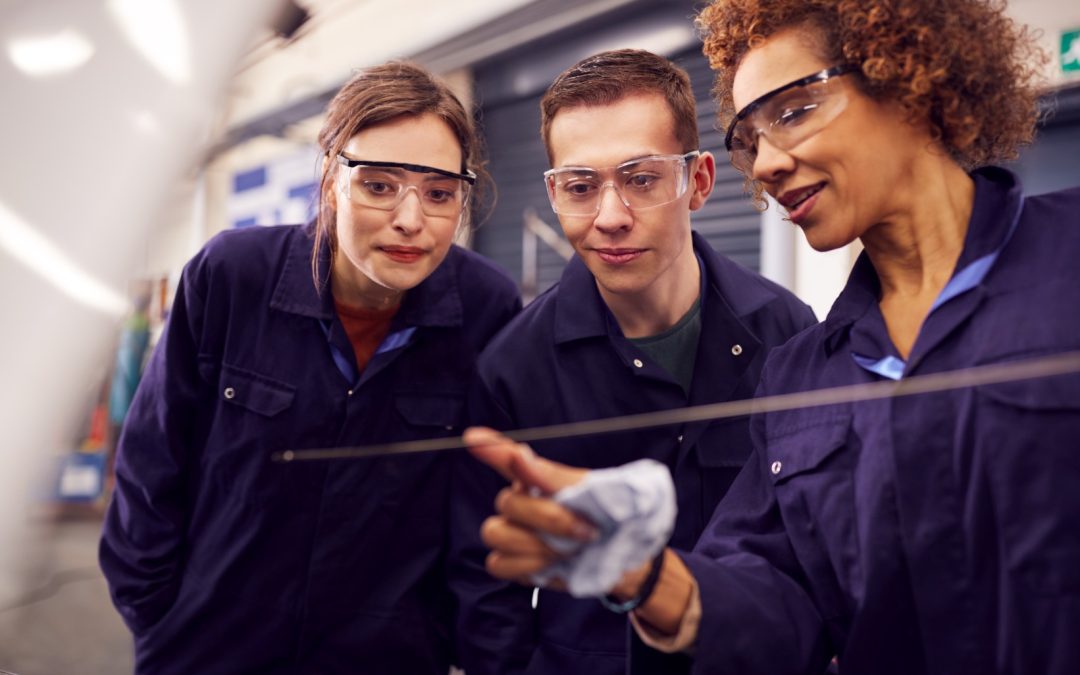 female-tutor-with-students-checking-oil-level-in-c-2026-03-10-03-17-36-utc-1-1