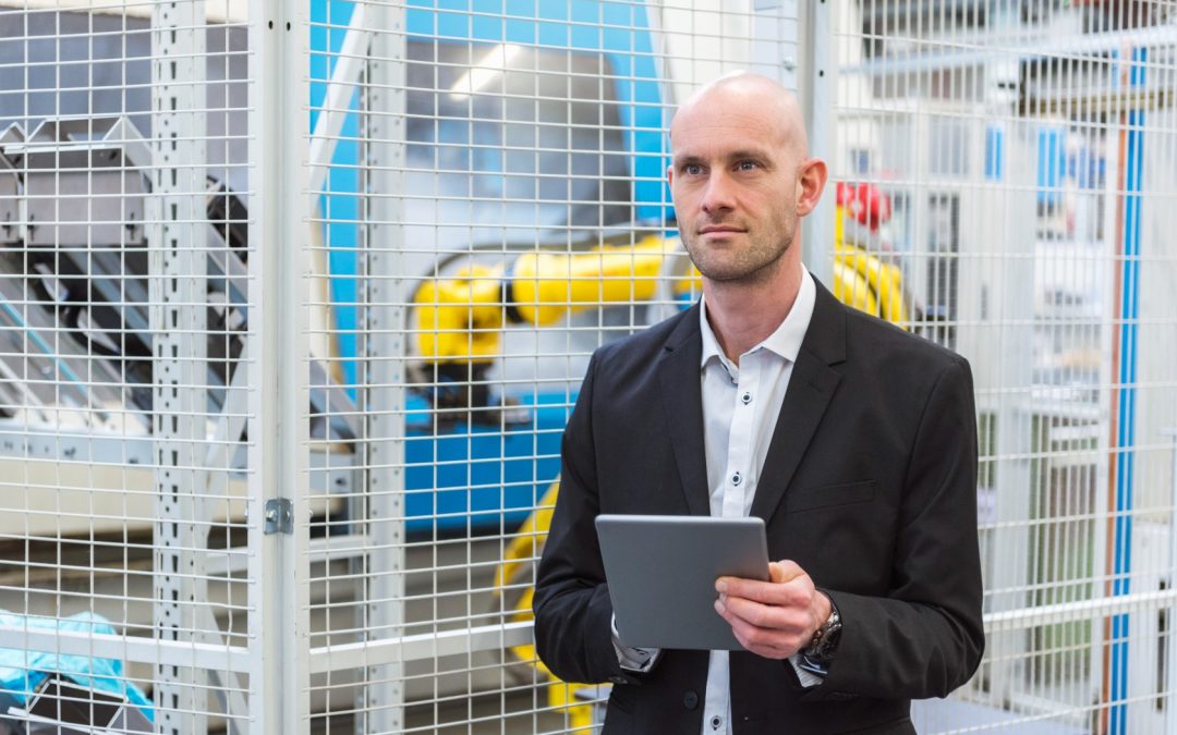 businessman-with-tablet-in-modern-factory-2026-01-05-00-43-22-utc-1-1